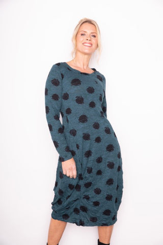 Liv by Habitat's Jetset Crinkle Dress in Spruce. Cotton blend, rich green fabric with artistic black dot pattern.  Round neckline, line sleeves, relaxed fit and ruched detail on skirt.
