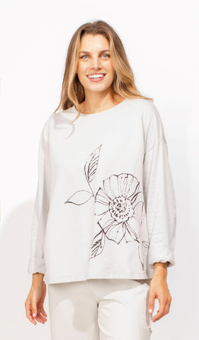 Escape by Habitat's Floral Outline Pullover, cotton sweatshirt style top with large floral line drawing on the front. Roune neck, long sleeves, relaxed, boxy fit.