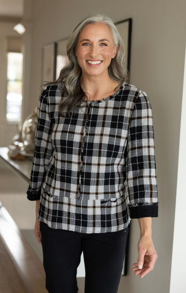Habitat Perfect Plaid Pullover in Putty. Black and off-white plaid pattern with raw seam details, cuffed sleeves, front pockets and round neckline.