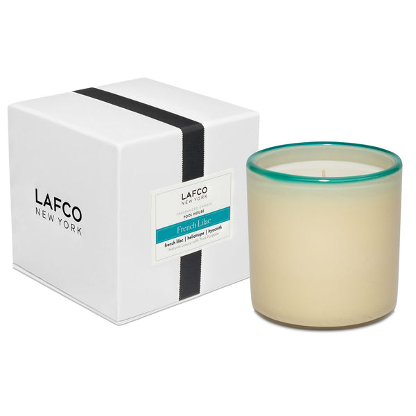 Cream Lafco Candle with a blue rim scented "Fresh Lilac".