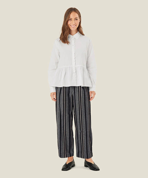 Masai Piedad Black and white striped straight leg pants. High waist, pleated front, pockets. well tailored.