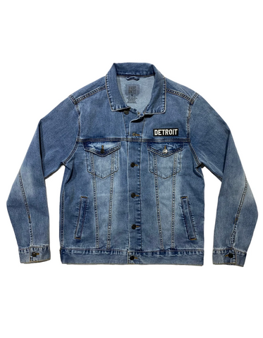 Denim jacket with black and white "detroit" patch above left chest pocket