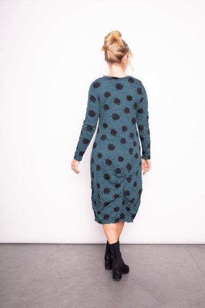 Liv by Habitat's Jetset Crinkle Dress in Spruce. Cotton blend, rich green fabric with artistic black dot pattern.  Round neckline, line sleeves, relaxed fit and ruched detail on skirt.