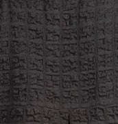 Habitat Pucker Weave Pullover in black swatch. Boxy shape, pucker textured fabric, exposed seam details, bracelet length sleeves, round neckline.