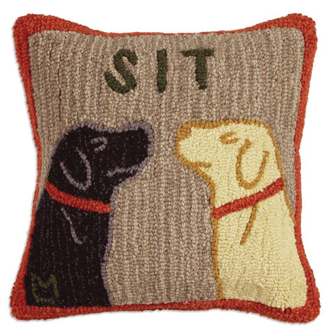 Hooked wool pillow - brown with red border. Features a black lab and yellow lab with the word "Sit" centered above their heads.