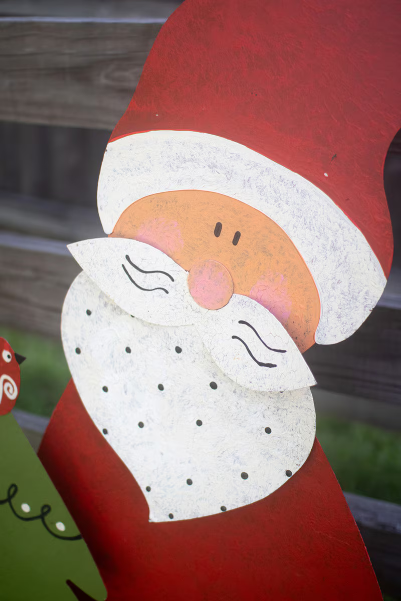 Santa with Christmas Tree Metal Yard Art Available at Leon & Lulu