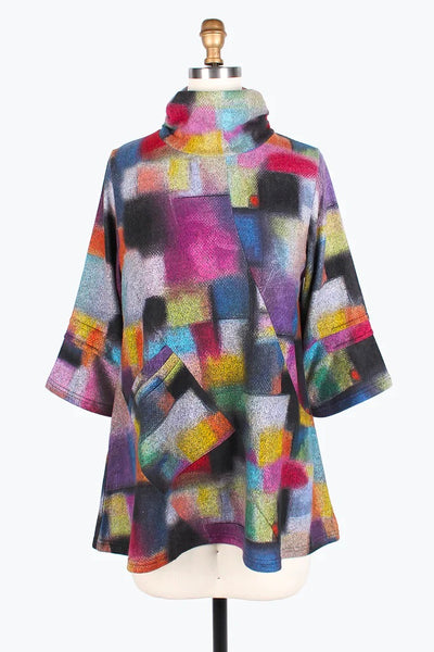 Damee Colorblock Tunic. Multi color square pattern, diagonal seams, funnel neck, wide cropped sleeves, patch pocket on front, tunic length.