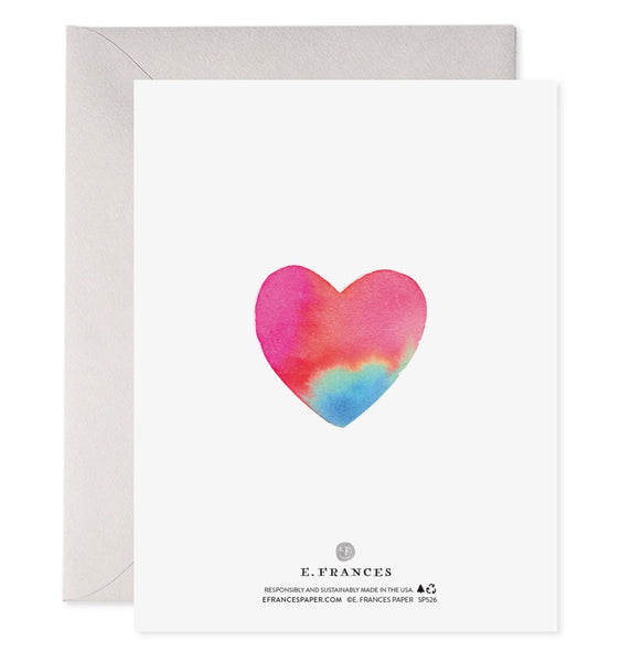 A rainbow watercolor heart is center on the back of the card