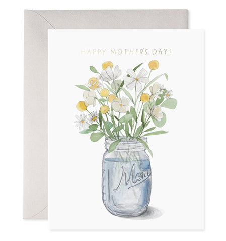 A mason jar full of wildflowers with "Happy Mother's Day!" written above