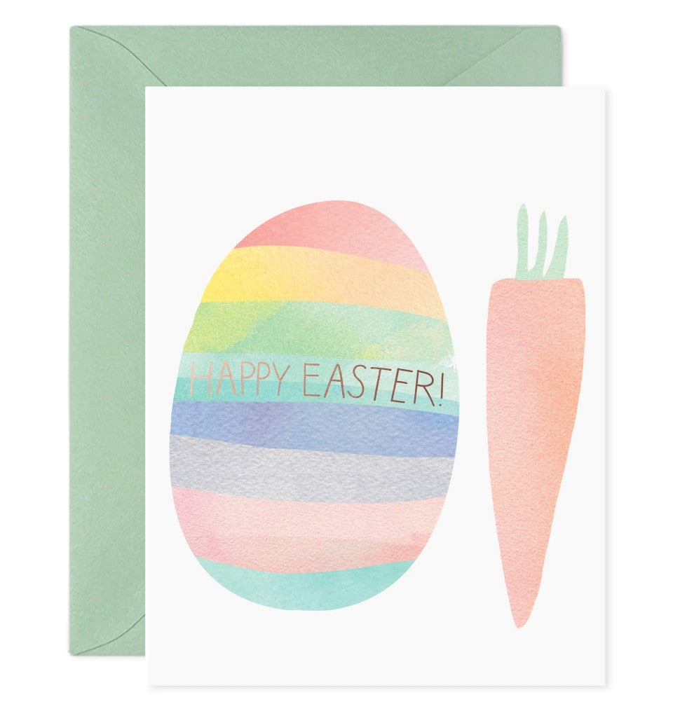 Greeting card with a rainbow easter egg and carrot. Gold script across the egg reads "Happy Easter!"