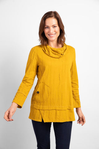 Habitat Steady Stream Pocket Tunic in Dijon Yellow.  Texturally pleated fabric, cowl neck, long sleeves, angled front pocket with button detail and pleated notched hem.