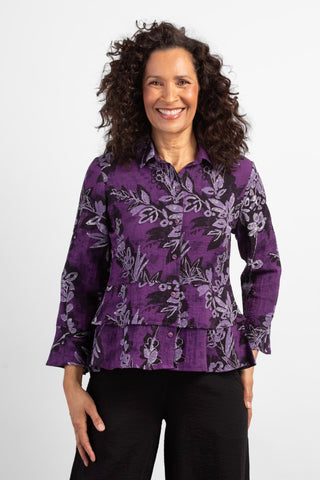 Habitat Floral Flounce Top in Damson purple floral pattern. Long sleeves, button front, tiered layers.