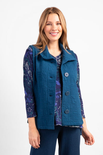 Habitat Box Quilted Travel Vest in Baltic Blue.  Sleeveless vest, button up front with oversized buttons, pointed collar, relaxed fit. Modern box-like quilted texture.