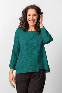Habitat Pucker Weave Pullover in teal.  Boxy shape, pucker textured fabric, exposed seam details, bracelet length sleeves, round neckline.