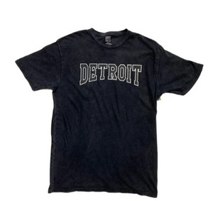 Ink Detroit Mineral Wash Black T-shirt with "Detroit" printed across the chest in grey and white text.