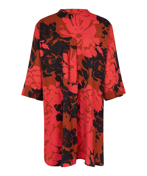 Masai Geam Button Up Tunic in Picante. Red and black floral print, half sleeves, oversized fit, tunic length.