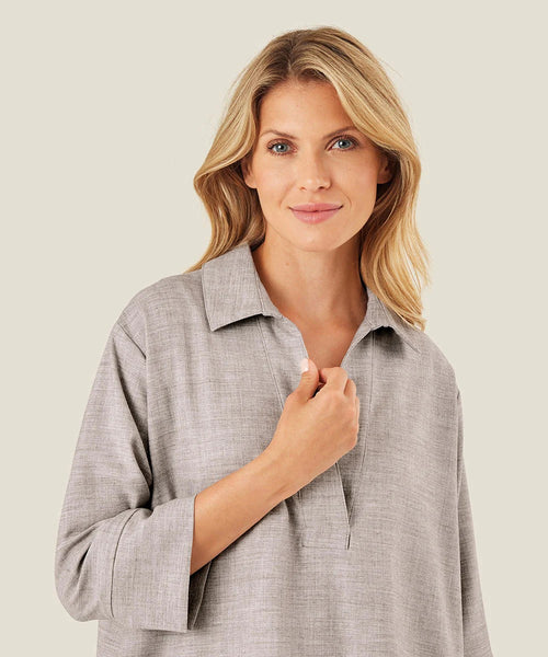 Masai Dipa 3/4 sleeve top in light grey melange color.  Boxy fit with rounded hem, wide sleeves and collared henley neckline.
