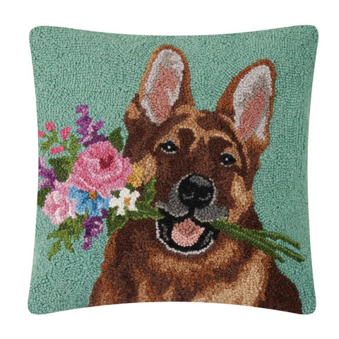 Seafoam green hooked wool pillow with a German Shepherd Dog holding flowers in its mouth