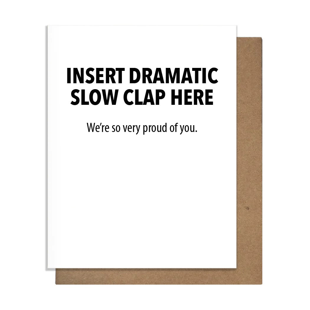 White greeting card with black text that reads : Insert dramatic slow clap here.  We're so very proud of you.