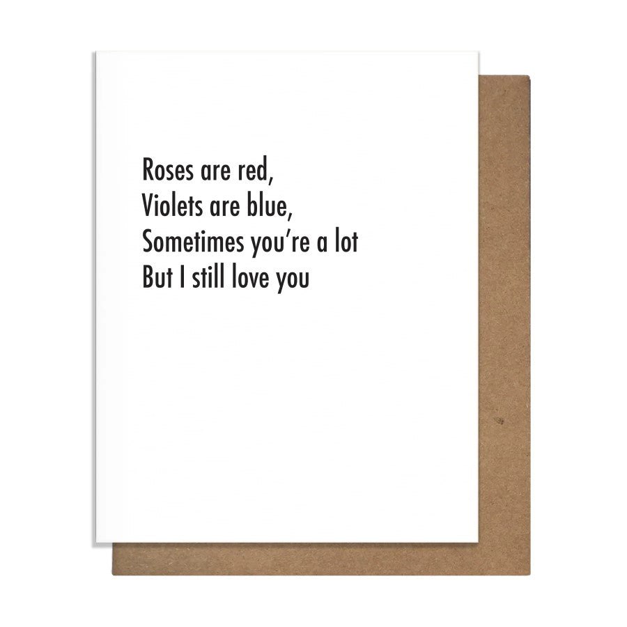 White greeting card that reads "Roses are red, violets are blue, sometimes you're a lot, but I still love you