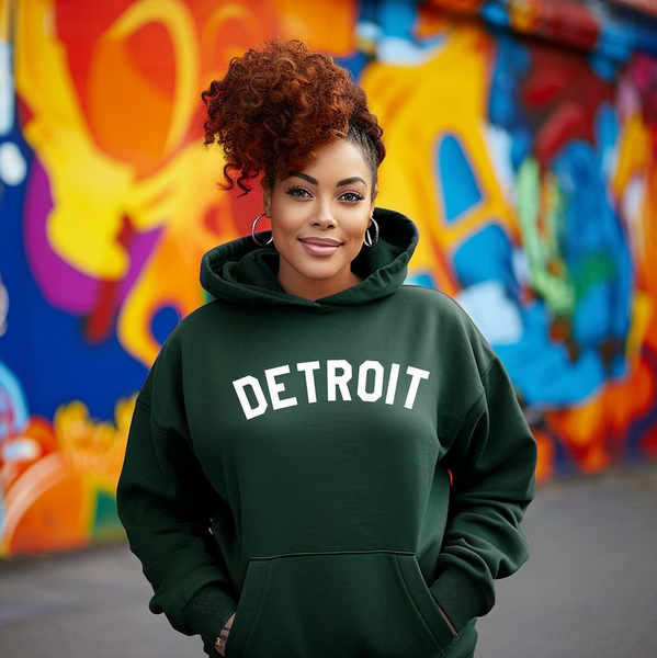 Forest green hoodie with "Detroit" in white lettering across the chest.