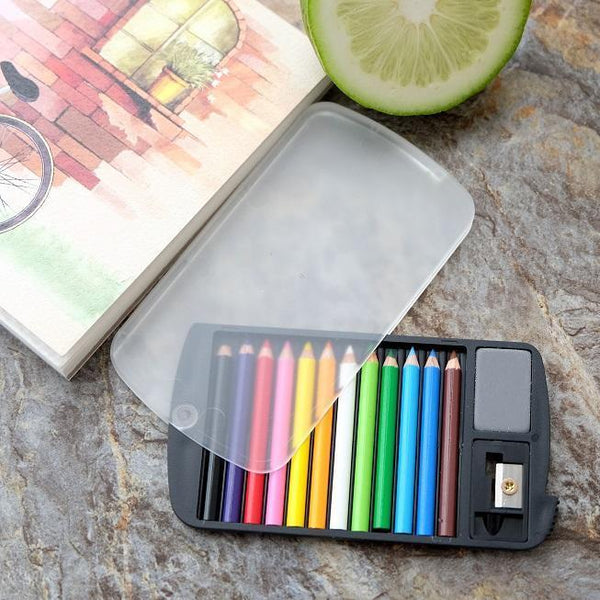 Black case with clear rotating lid containing colored pencils, small eraser, and pencil sharpener.