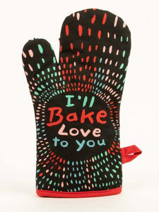 Black oven mitt with red white and blue accents. Has text that reads "I'll bake love to you."