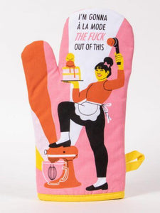 Pink oven mitt with yellow and orange accents, has a woman using an electric mixer as a stool and lifting up a cake, contains text that says "I'm gonna a la mode the fu** out of this."