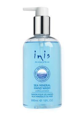 Clear pump bottle filled with blue soap. Displayed on the bottle is the text "Inis Sea Mineral Hsnd Wash".