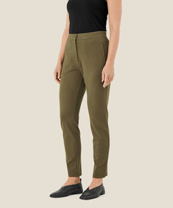 Masai Pamala Trouser in Capers, a lovely olive green color. Slim leg, zip fly with button closure, on seam pockets.