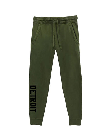 Ink Detroit olive green mineral wash joggers with "Detroit" printed down right leg in black ink.  Front pockets and drawstring waist.