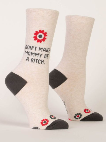 White crewsocks that say "Don't make mommy be a b***h."