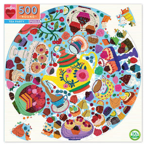 Circular blue puzzle filled with tea party motifs such as a tea pot, various pastries, and teacups.