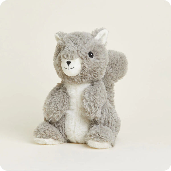 Plush squirrel. Plush has a gray coat, white belly, large bushy tail, white snout, black, beady eyes, and little ears.