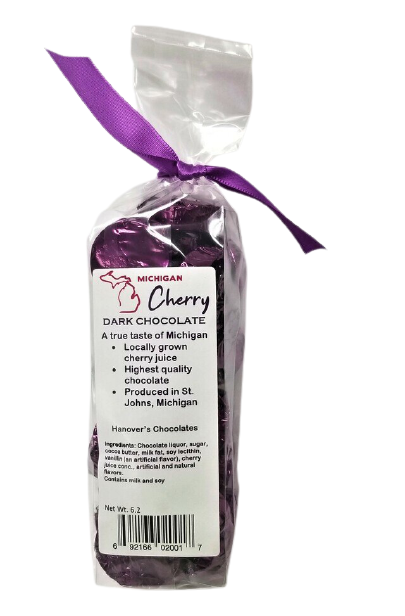 Plastic bag filled with dark cherry filled dark chocolate. Tied with a purple ribbon.