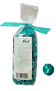 Plastic bag filled with mint flavored chocolate. Tied with a cyan ribbon.